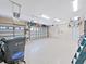 Clean and organized garage with epoxy flooring, storage shelves, and ample space for vehicles at 15024 Eaglepark Pl, Lithia, FL 33547