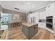 Eat-in kitchen with an island, stainless appliances, white cabinets, and an adjacent dining area at 15024 Eaglepark Pl, Lithia, FL 33547