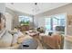 Inviting living room with large windows, access to the outdoor pool, and comfortable furniture at 15024 Eaglepark Pl, Lithia, FL 33547