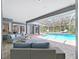 Covered pool with ample lounge seating for entertaining and relaxing poolside at 15024 Eaglepark Pl, Lithia, FL 33547