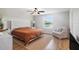 Bedroom featuring a window with a view, white trim, ceiling fan, and chair at 1655 Blue Rose Dr, Ruskin, FL 33570