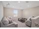 Spacious bonus room with carpet, projector, comfortable seating, and natural light at 1655 Blue Rose Dr, Ruskin, FL 33570