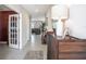 Inviting entryway with tile flooring, decorative console table, and stylish decor at 1655 Blue Rose Dr, Ruskin, FL 33570