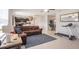 Open-concept living room flows into the kitchen with a dining area and natural light at 1655 Blue Rose Dr, Ruskin, FL 33570