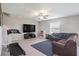 Spacious living room with neutral walls, large TV, and comfortable seating area at 1655 Blue Rose Dr, Ruskin, FL 33570