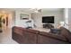 Comfortable living room with a large sectional couch and modern entertainment center at 1655 Blue Rose Dr, Ruskin, FL 33570