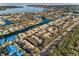 Scenic aerial view of a waterfront community with canals, boat docks, and lush landscapes at 1660 Cape Ann Ne Ave # 2, St Petersburg, FL 33702