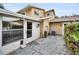 Backyard patio area with access to the home's enclosed sunroom and outdoor amenities at 1660 Cape Ann Ne Ave # 2, St Petersburg, FL 33702