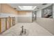 Spacious unfinished basement featuring a skylight ready for customization and renovations at 1660 Cape Ann Ne Ave # 2, St Petersburg, FL 33702