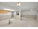 Large open basement space with exposed ceiling, and staircase awaiting customization at 1660 Cape Ann Ne Ave # 2, St Petersburg, FL 33702
