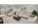 Partially finished basement showcasing stairs, a cozy seating area, and neutral color palette at 1660 Cape Ann Ne Ave # 2, St Petersburg, FL 33702