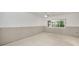 Unfinished basement room with clean concrete floors, natural light, and ready for renovation at 1660 Cape Ann Ne Ave # 2, St Petersburg, FL 33702