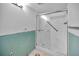 Bathroom featuring a glass shower door, grab bar, and white shower at 1660 Cape Ann Ne Ave # 2, St Petersburg, FL 33702