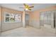 Bedroom featuring a ceiling fan, window views, neutral paint and light-colored baseboards at 1660 Cape Ann Ne Ave # 2, St Petersburg, FL 33702