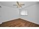Bright bedroom with hardwood floors, neutral walls, and a ceiling fan at 1660 Cape Ann Ne Ave # 2, St Petersburg, FL 33702