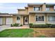Charming townhouse featuring a well-maintained lawn, inviting entry, and a two-story design at 1660 Cape Ann Ne Ave # 2, St Petersburg, FL 33702