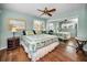 Spacious main bedroom with ample light, mirrored closets, and decorative furniture at 1660 Cape Ann Ne Ave # 2, St Petersburg, FL 33702