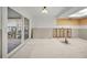 Unfinished area with sliding glass doors leading to an enclosed patio area and an open wall space at 1660 Cape Ann Ne Ave # 2, St Petersburg, FL 33702