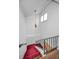 View of the stairway featuring red carpet on the steps and a dark handrail at 1660 Cape Ann Ne Ave # 2, St Petersburg, FL 33702