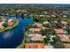 Beautiful aerial view of waterfront homes featuring private pools, scenic lake views, and mature trees at 17921 Arbor Haven Dr, Tampa, FL 33647