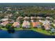 Aerial view of lakeside houses featuring well-manicured lawns and beautiful surroundings at 17921 Arbor Haven Dr, Tampa, FL 33647