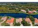 Aerial view showcasing stunning lakeside homes with pools, manicured lawns, and lush greenery at 17921 Arbor Haven Dr, Tampa, FL 33647