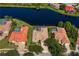 Overhead image of adjacent homes with enclosed pools, manicured lawns, and distinctive red-tile roofs at 17921 Arbor Haven Dr, Tampa, FL 33647