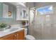 Bright bathroom featuring glass shower, vanity and designer decor at 17921 Arbor Haven Dr, Tampa, FL 33647