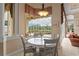 Cozy breakfast nook with views of the screened pool area, offering a relaxing space for casual dining at 17921 Arbor Haven Dr, Tampa, FL 33647