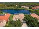 An aerial view shows the backyard, lake, and surrounding homes in the community at 17921 Arbor Haven Dr, Tampa, FL 33647