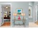 Stylish foyer with decorative table, lamps, and view into adjacent office at 17921 Arbor Haven Dr, Tampa, FL 33647