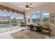 Bright home office with scenic pool and backyard view, offering a productive and inspiring workspace with natural lighting at 17921 Arbor Haven Dr, Tampa, FL 33647