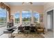 Well-lit home office featuring a serene view, offering a comfortable workspace with natural light and views of the tranquil yard at 17921 Arbor Haven Dr, Tampa, FL 33647