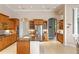 Open kitchen with a large island, stainless steel appliances, and wood cabinets, seamlessly blending style and functionality at 17921 Arbor Haven Dr, Tampa, FL 33647