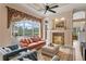 Bright living room with comfortable seating, fireplace, and view of the pool area, all in an open and inviting layout at 17921 Arbor Haven Dr, Tampa, FL 33647