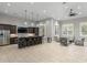 Spacious recreation room featuring a kitchen area, bar seating, and comfortable lounge area at 17921 Arbor Haven Dr, Tampa, FL 33647