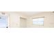 Bright bedroom featuring an ample closet and a sun-filled window that provides views and natural light at 1808 Elmwood Dr, Oldsmar, FL 34677