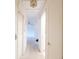 Clean and well-lit hallway with neutral walls and ceiling fixtures, connecting various rooms in the home at 1808 Elmwood Dr, Oldsmar, FL 34677
