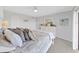 Bedroom with white furniture, ceiling fan and lots of pillows at 19451 Gulf Blvd # 205, Indian Shores, FL 33785