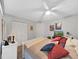 Comfortable bedroom featuring a ceiling fan, closet, and decorations displayed around the room at 19451 Gulf Blvd # 205, Indian Shores, FL 33785