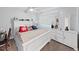 Bedroom with a white bed frame, carpet and a ceiling fan at 19451 Gulf Blvd # 205, Indian Shores, FL 33785