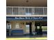 View of building entrance showing signage for Bay Shores Yacht & Tennis Club at 19451 Gulf Blvd # 205, Indian Shores, FL 33785