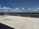 Enjoy the rooftop with clear blue skies and some outdoor seating at 19451 Gulf Blvd # 205, Indian Shores, FL 33785