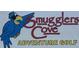 Close-up of the Smugglers Cove Adventure Golf sign with a blue parrot at 19451 Gulf Blvd # 205, Indian Shores, FL 33785