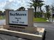 Bay Shores Yacht & Tennis Club welcome sign, prominently displayed at community entrance at 19451 Gulf Blvd # 205, Indian Shores, FL 33785
