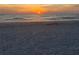 View of the sunset over the ocean and sandy beach at 19451 Gulf Blvd # 205, Indian Shores, FL 33785