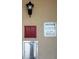 Photo of the trash disposal area with posted regulations and metal receptacle doors on a stucco wall at 19451 Gulf Blvd # 205, Indian Shores, FL 33785