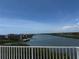 Scenic water view with buildings and a bright blue sky perfect for enjoying the waterfront lifestyle at 19451 Gulf Blvd # 205, Indian Shores, FL 33785