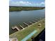 An aerial view of waterfront docks, a shuffleboard court, and well-maintained grassy areas along the canal at 19451 Gulf Blvd # 205, Indian Shores, FL 33785