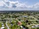 Scenic aerial view of the property's neighborhood showcasing views of the nearby lake at 21536 Holdern Ave, Port Charlotte, FL 33952